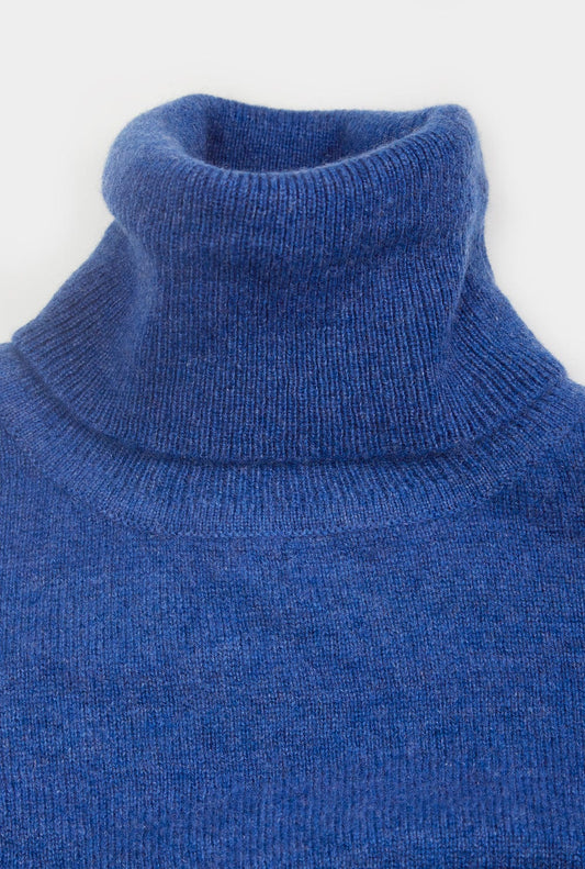 Women’s cashmere roll neck jumper in Denim.