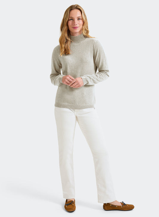Women’s cashmere roll neck jumper in Ecru.