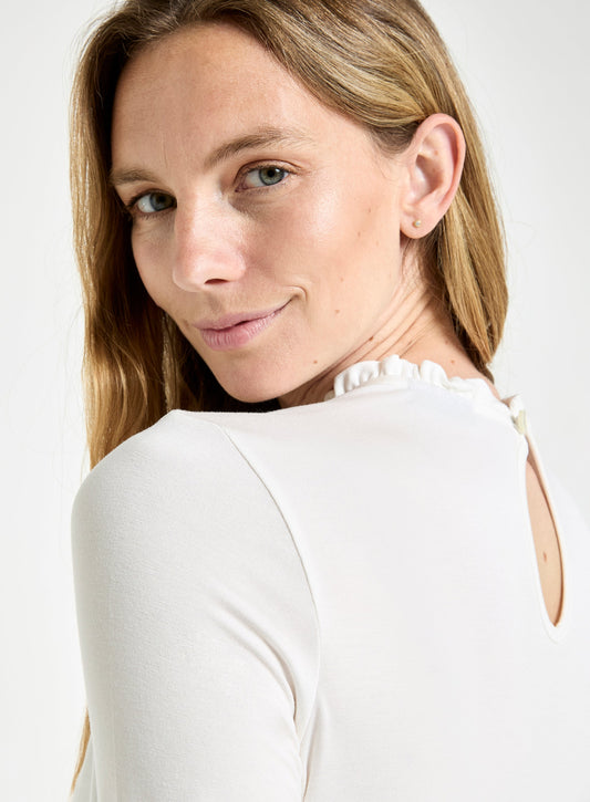 Women’s frill neck long sleeve top in Ivory.