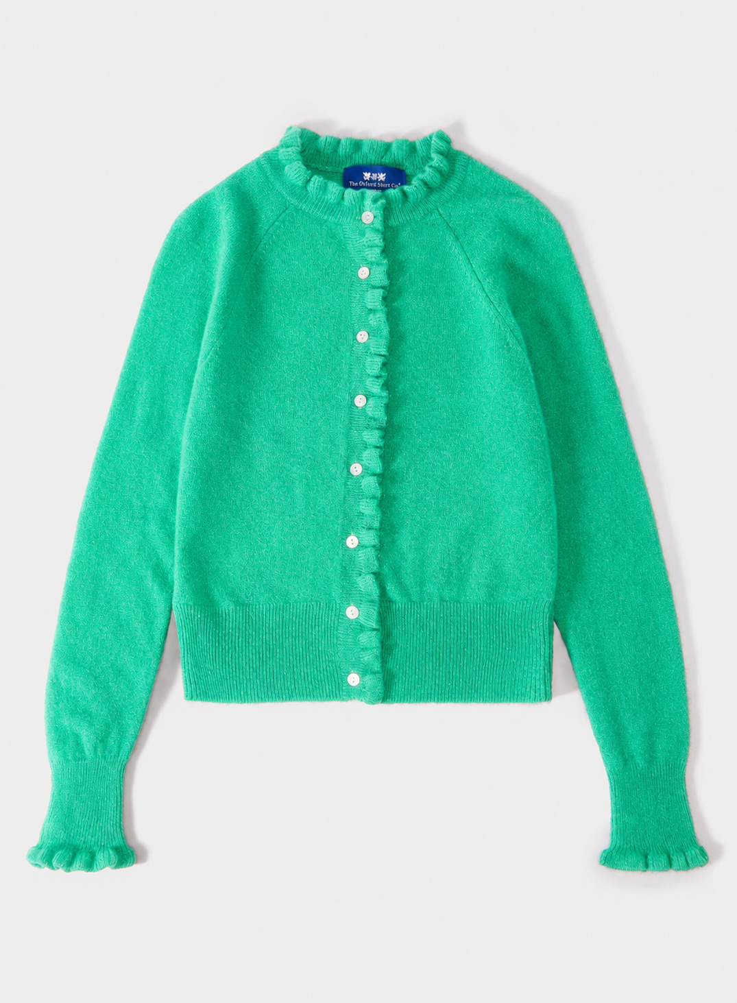 A bright green knit cardigan sweater with a ruffled collar, ruffled button placket, and ruffled cuffs, shown flat on a light gray background.
