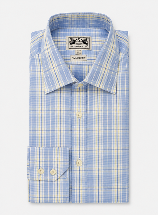 A folded light blue and white plaid dress shirt with a pointed collar and button-down front, displayed on a light gray background.