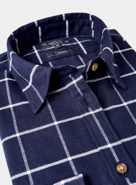Navy blue shirt with white checkered pattern on a white background