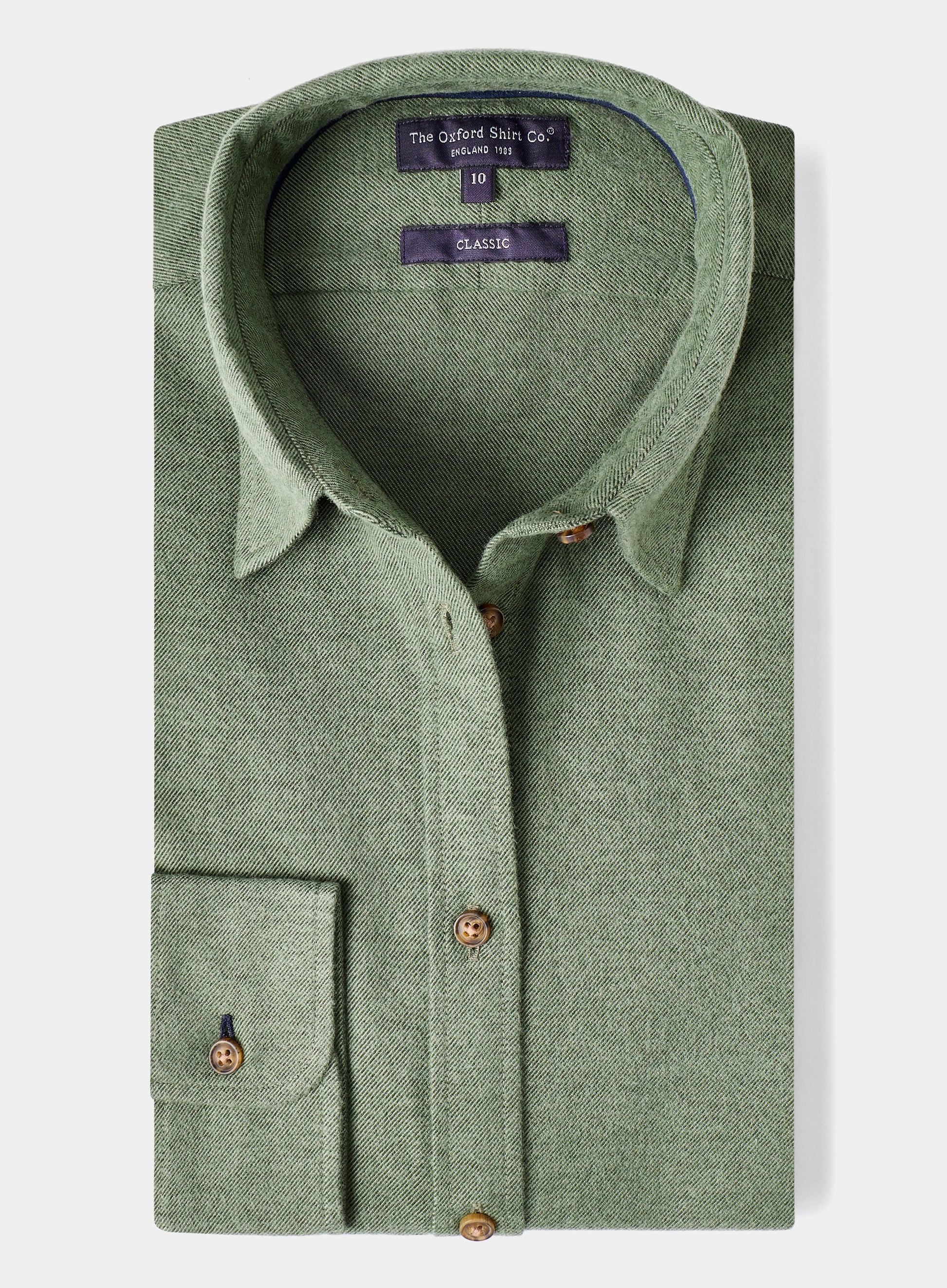 Green shirt with collar and buttons on a light gray background