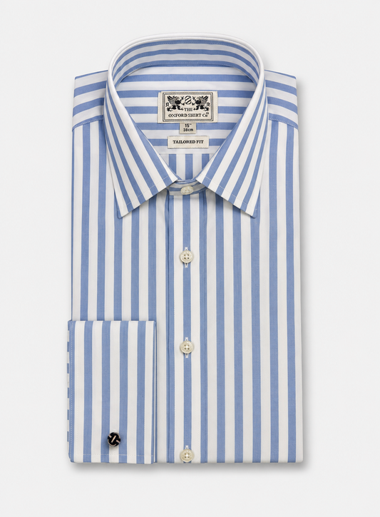 A folded long-sleeve dress shirt with vertical light blue and white stripes, featuring a pointed collar, button-down front, and a visible neck label for 'The Oxford Shirt Co.'