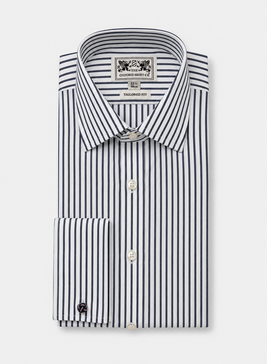 A folded dress shirt with vertical navy and white stripes, featuring a pointed collar, button front, and a single-button cuff. The neck label reads 'The Oxford Shirt Co.'