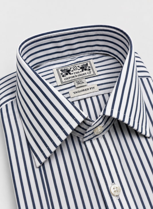 Close-up of a folded dress shirt collar showing the brand label 'Oxford Shirt Co' and the striped pattern of navy blue and white.