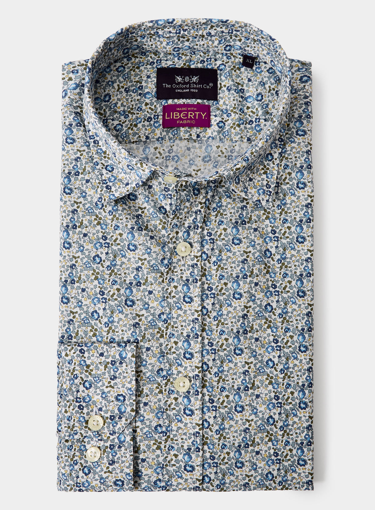 Floral patterned shirt with Liberty label on a white background