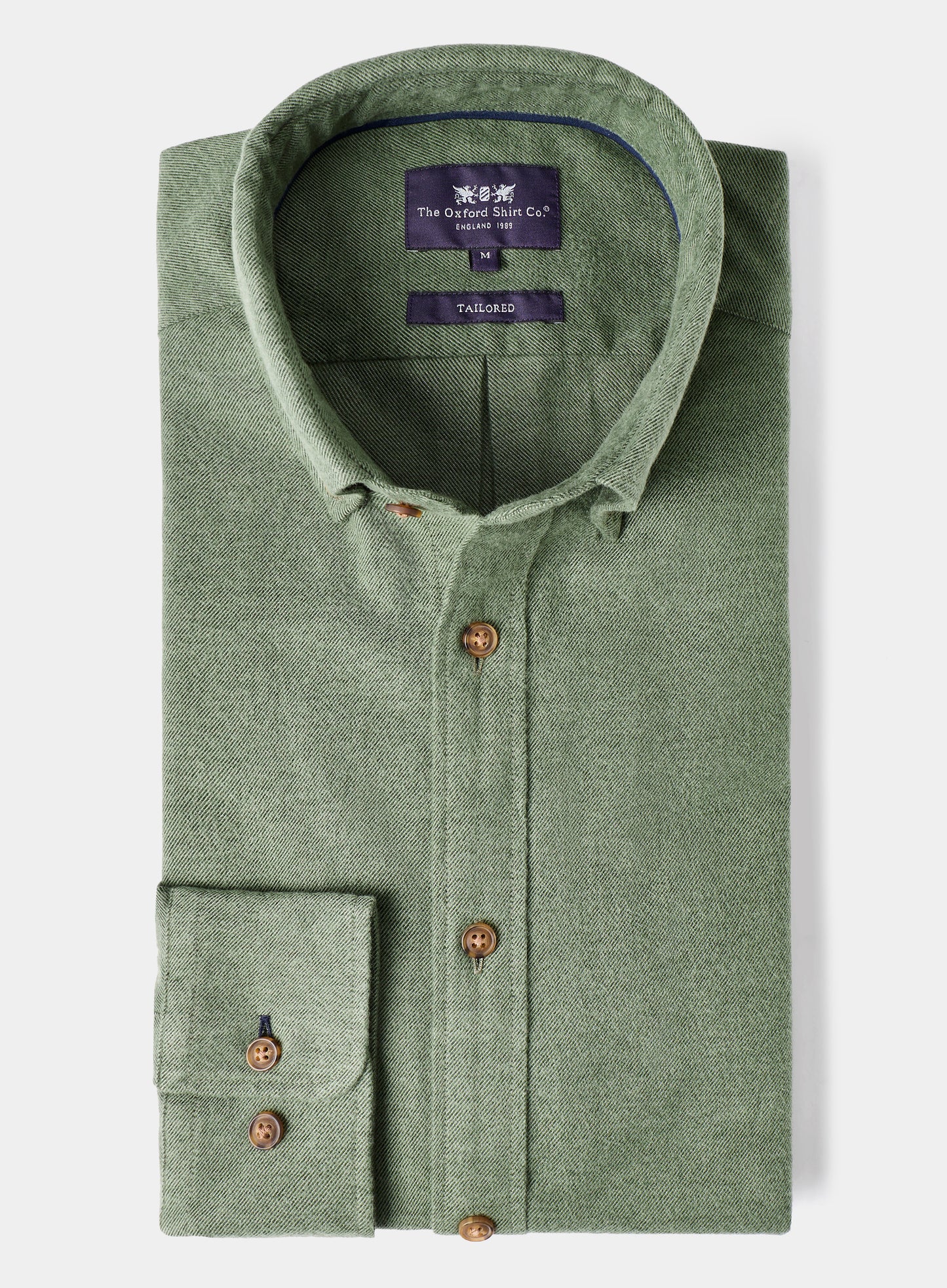 Green shirt with brown buttons on a white background