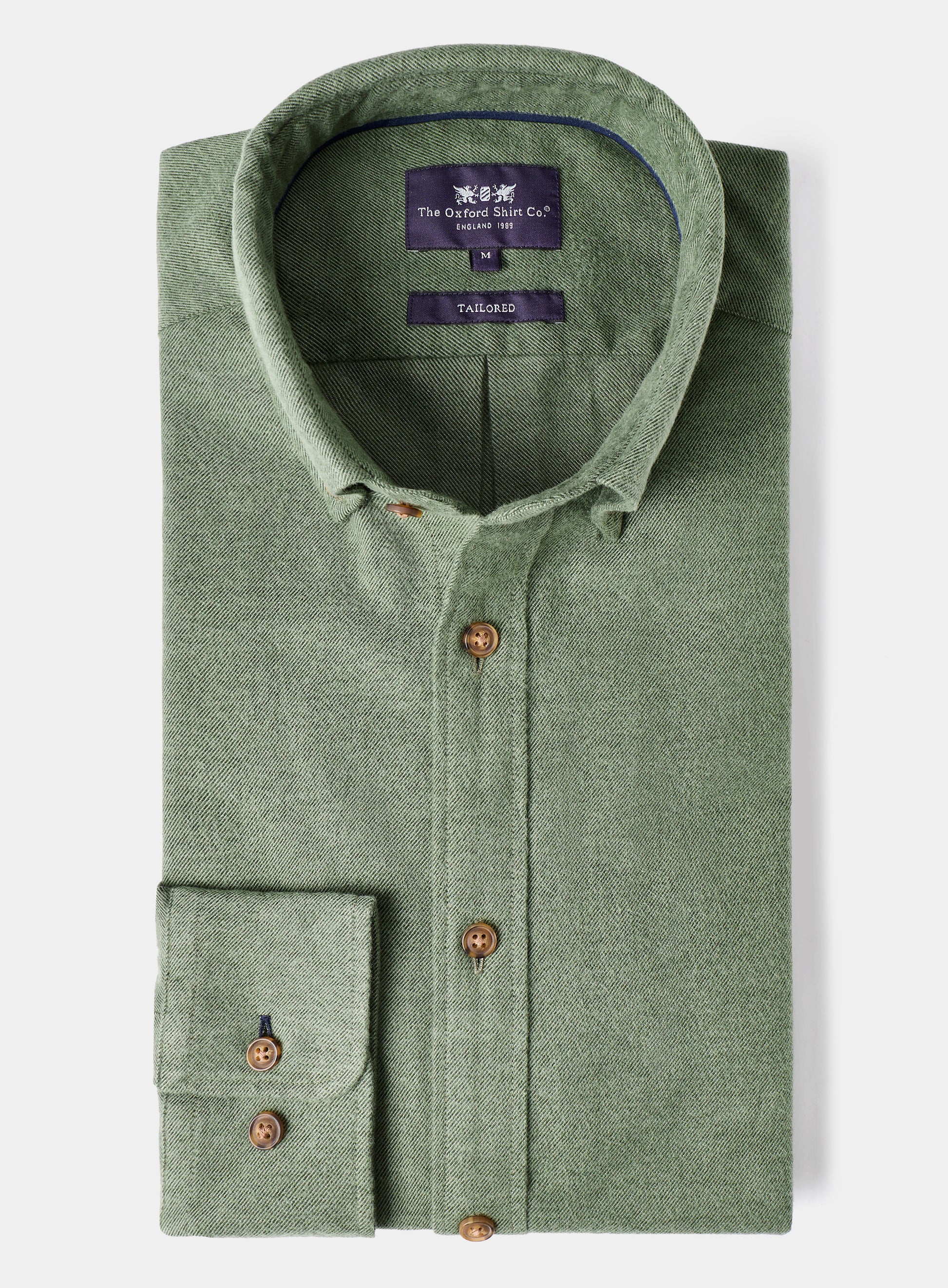 Green shirt with brown buttons on a white background