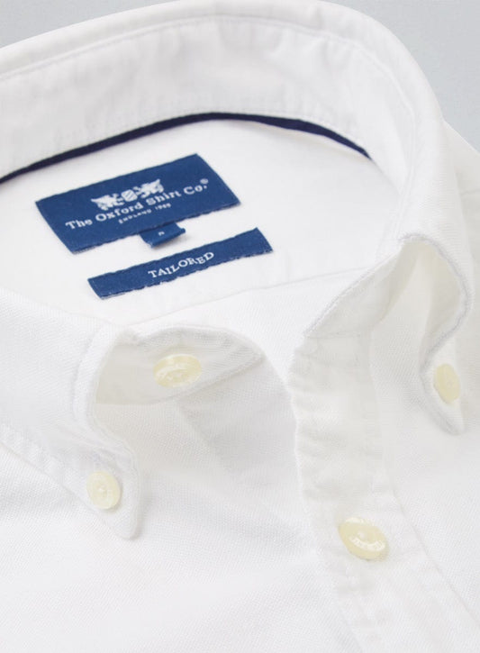 Close-up of men's white Oxford button-down shirt collar with Oxford Shirt Company Tailored Fit label
