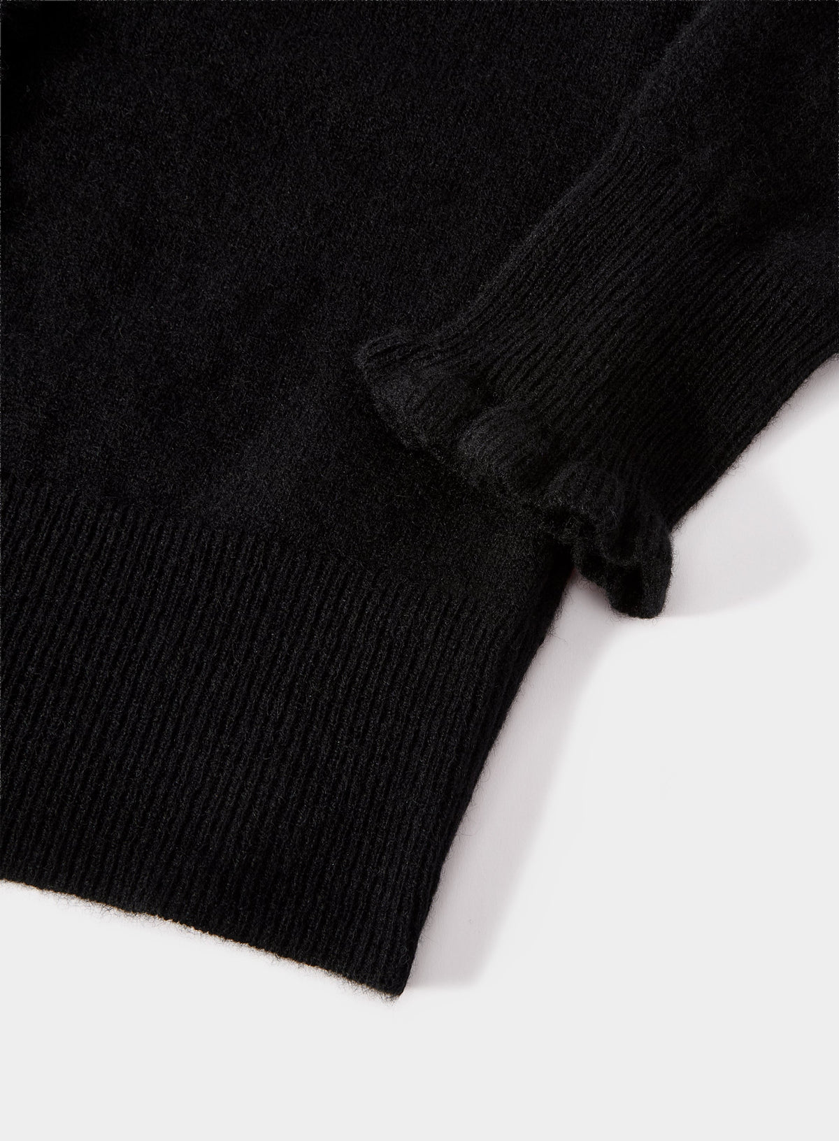 Women’s cashmere frill cardigan in Black.