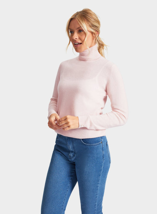 Women’s cashmere roll neck jumper in Pastel Pink.