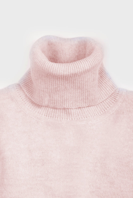 Women’s cashmere roll neck jumper in Pastel Pink.