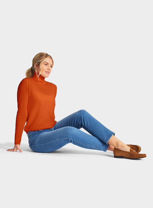 Women’s cashmere roll neck jumper in Rust.