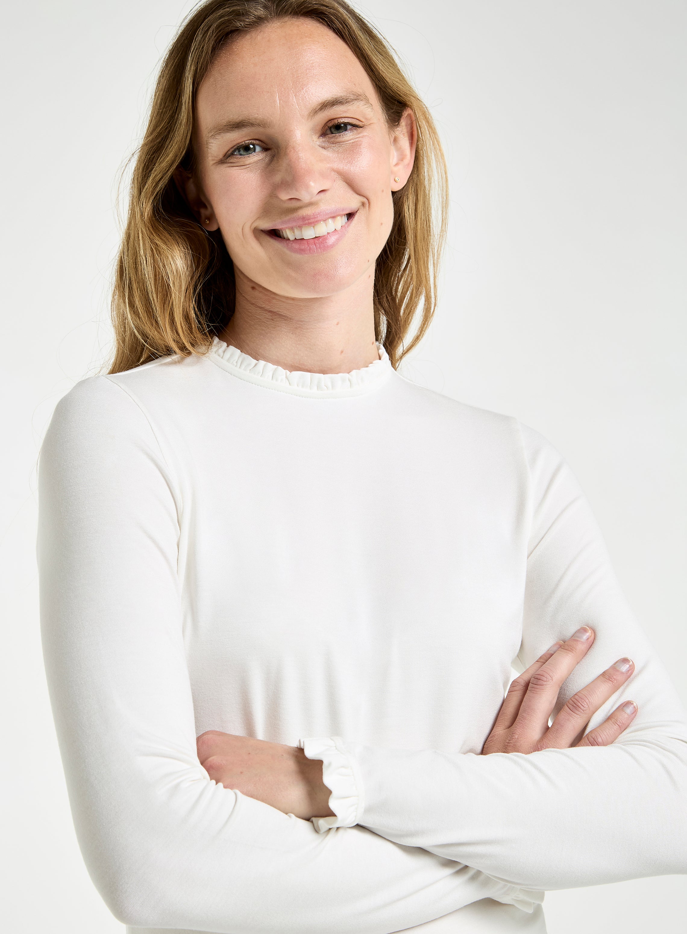 Women’s frill neck long sleeve top in Ivory.