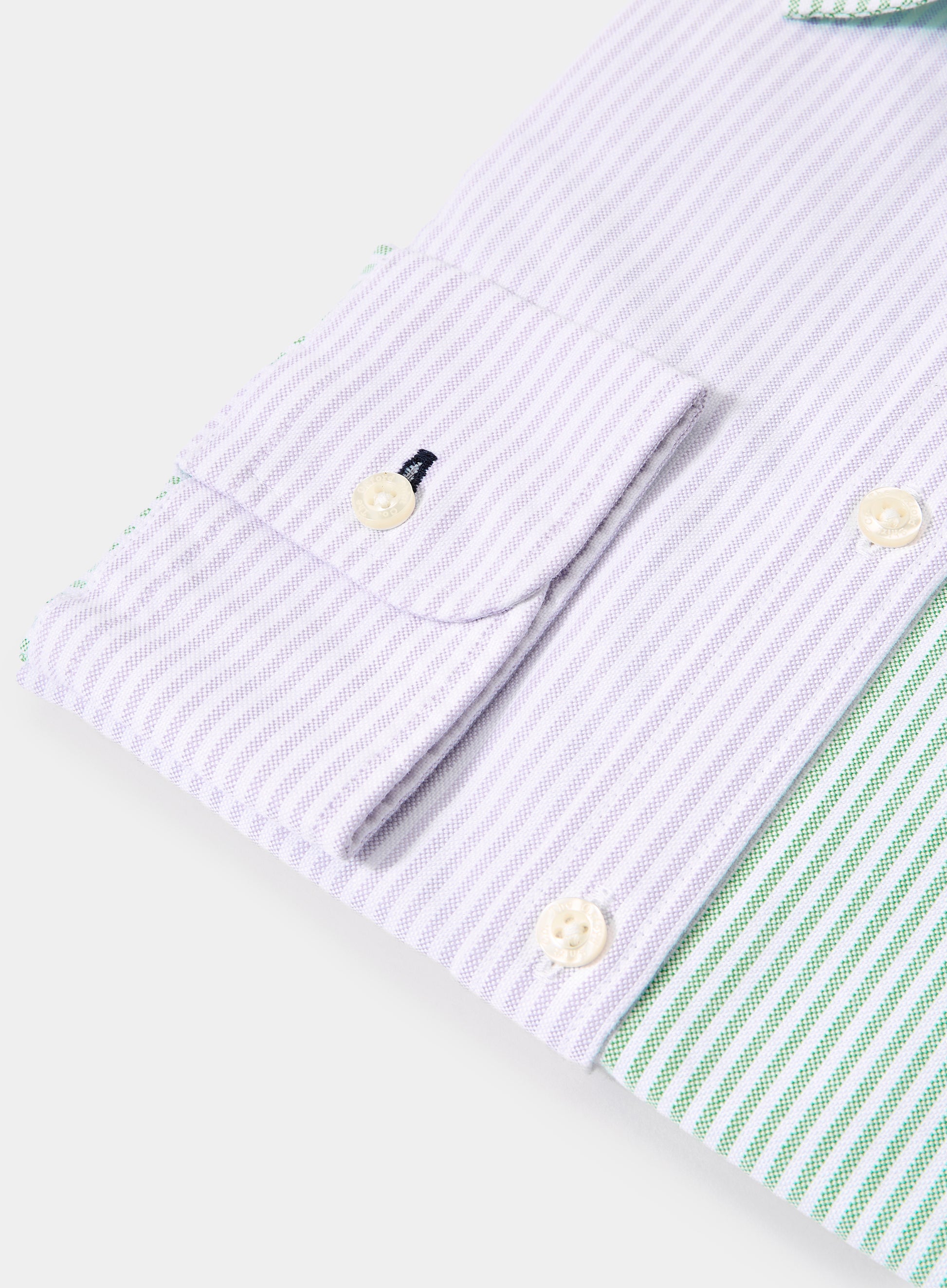 Close-up of women's lilac patch stripe Oxford shirt cuff with green striped panel and button detail