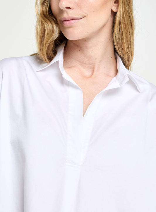 Women’s open collar blouse in White.